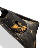 Black and gold swimfin with water droplets, showcasing durable design for swimming